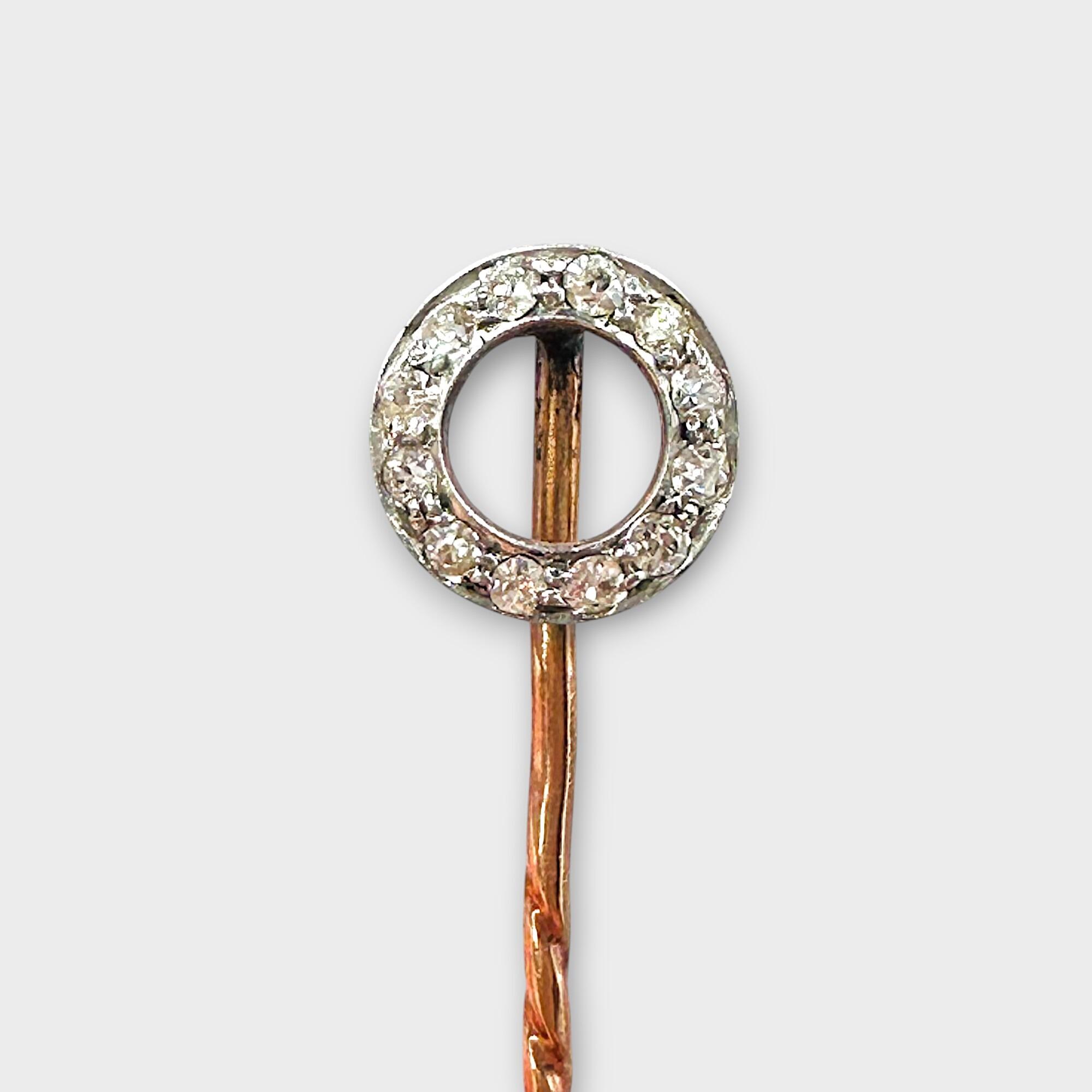 Art Deco stick pin in 15k rose gold featuring a diamond-set circle design on grey background.