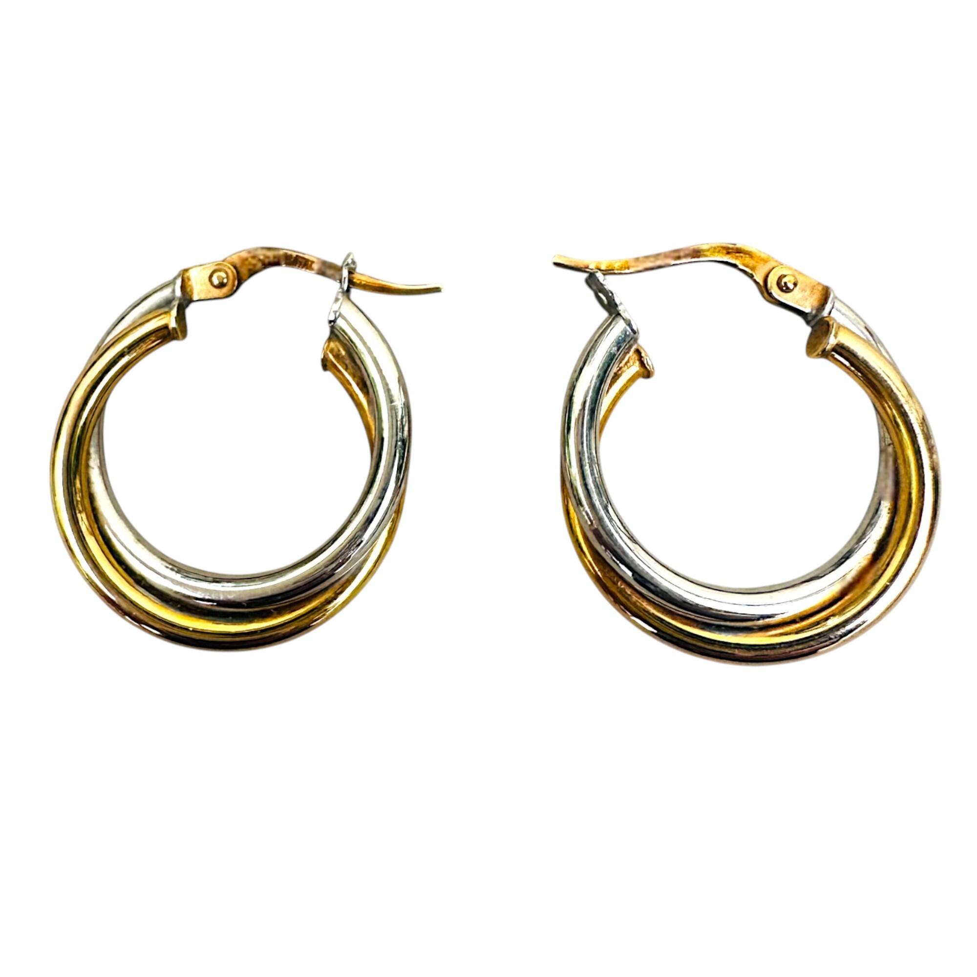 close up of Italian bi-colour 9k gold hoop earrings on white background.