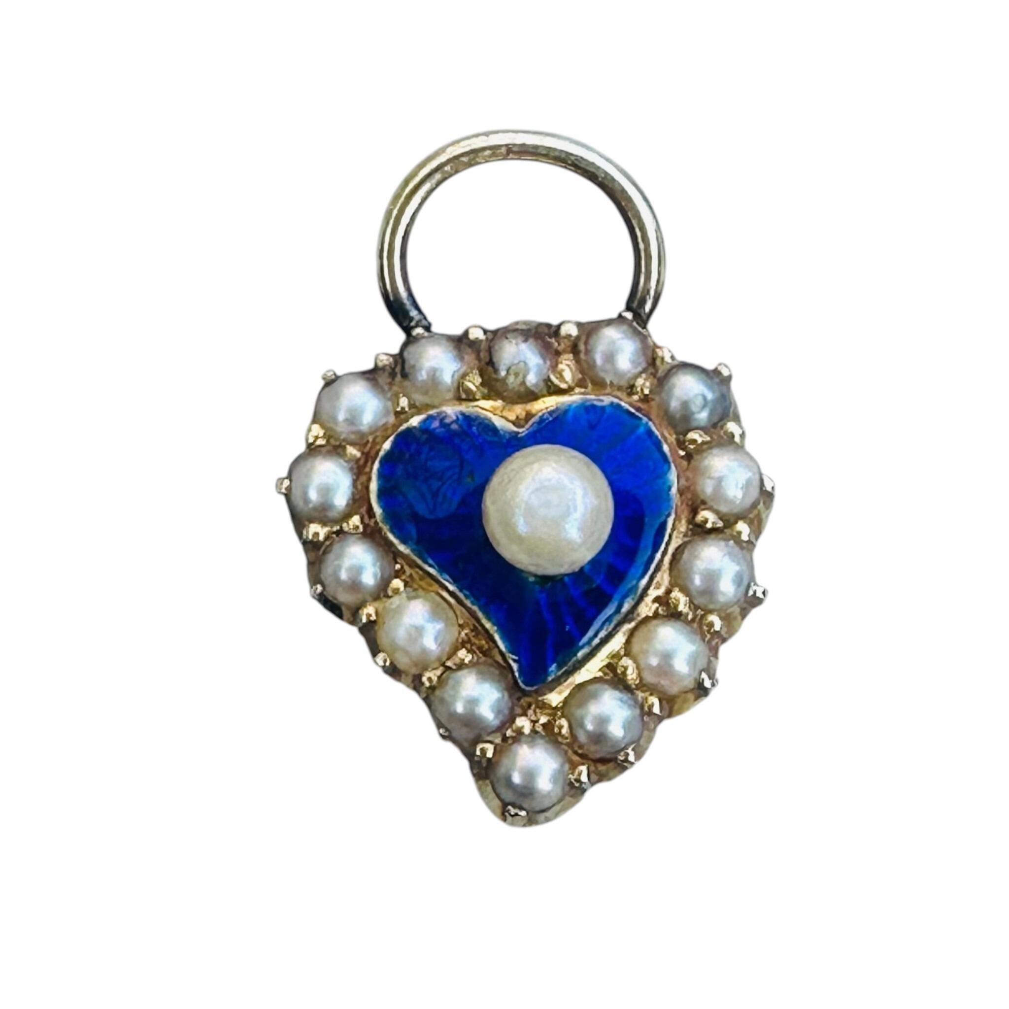 close up and front view of Antique Victorian 15ct Gold Puffy Heart Pendant with white background