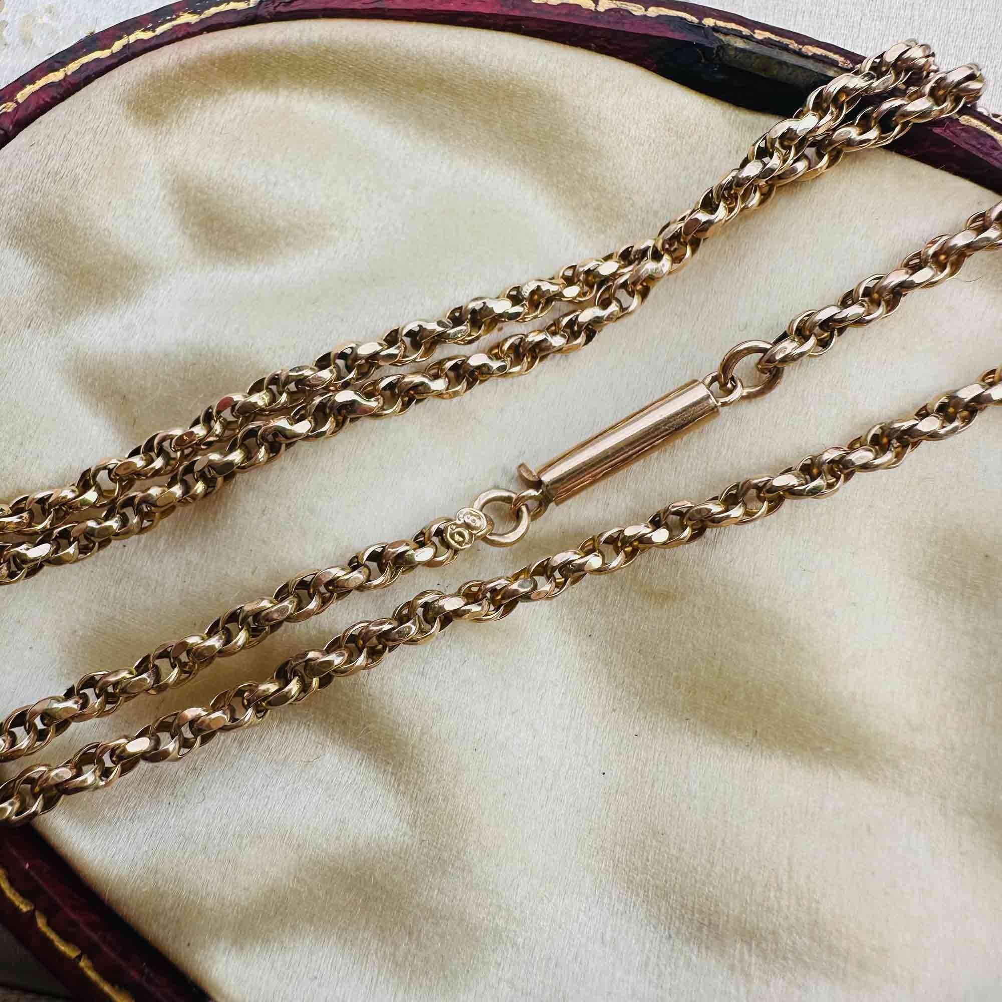 Antique 9ct gold rope chain necklace with classic barrel clasp, displayed in antique box.