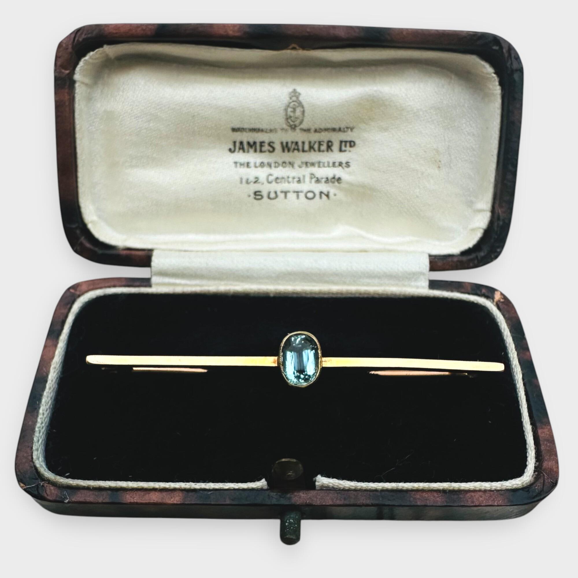 elegant Edwardian aquamarine bar brooch features a stunning 7x5mm oval aquamarine, mounted securely in a classic collet setting in antique box.