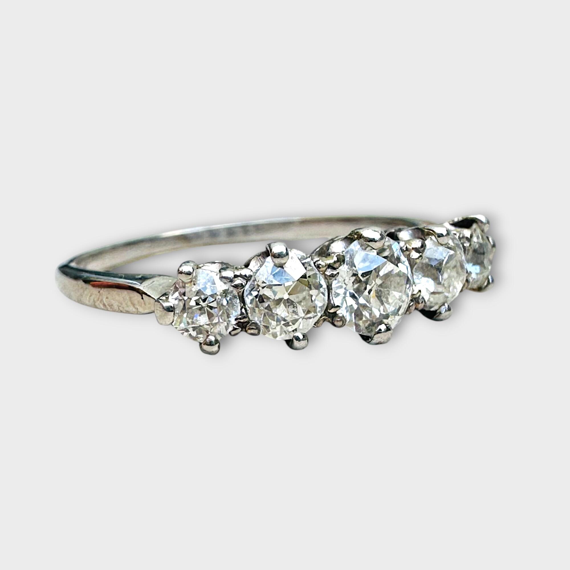 Edwardian five-stone diamond ring in 18K white gold with old European cut diamonds, featuring a 4.5mm center stone flanked by two 3.5mm and two 3mm diamonds, circa 1900s