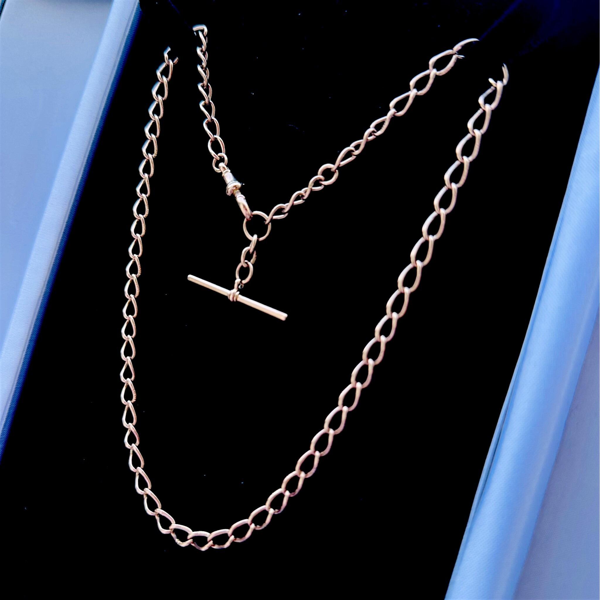 Rose Gold Curb Link Albert Chain With T-Bar & Dog Clip displayed on black velvet