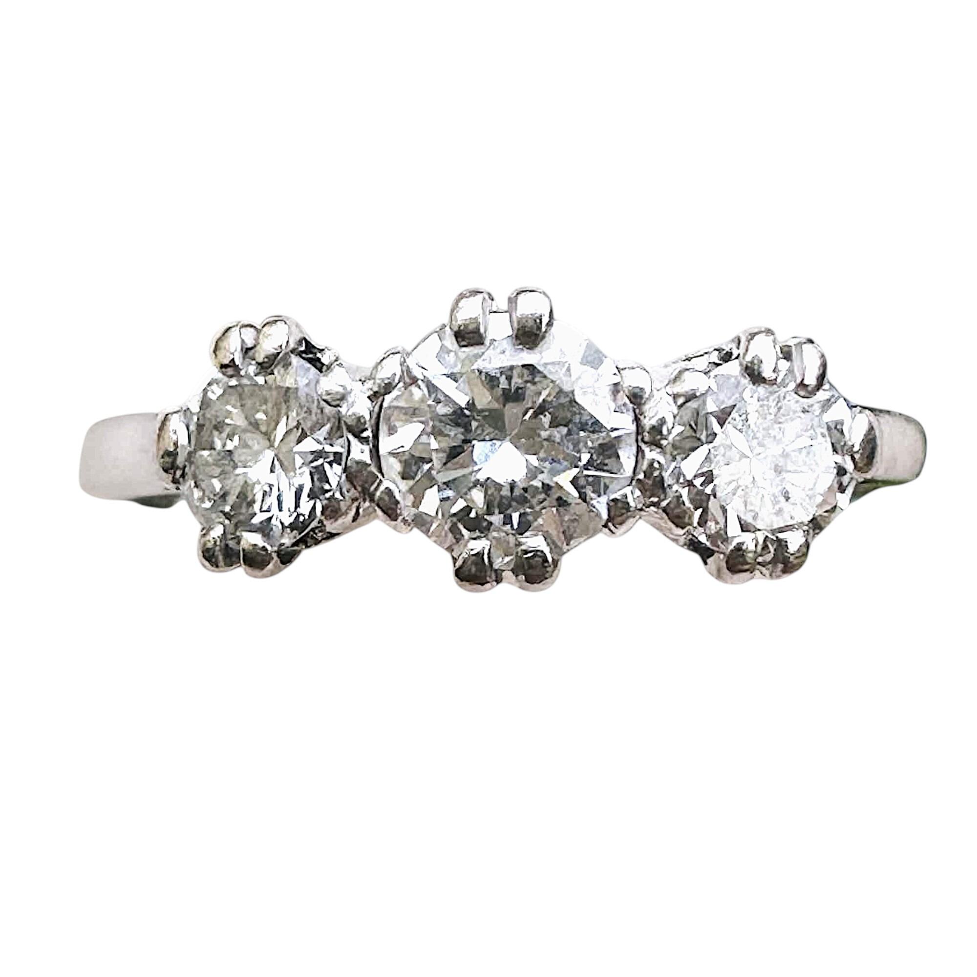 close up of Antique Art Deco Platinum & Diamond Trilogy Ring with white background