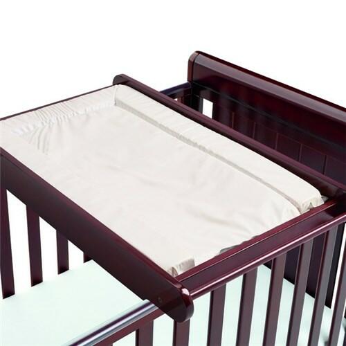 Cot bed with outlet changing top