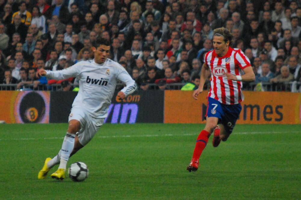 Cristiano Ronaldo alongside Diego Forlán during the Madrid derby on 28 March 2010