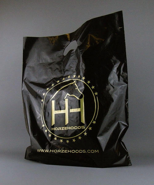 black plastic carrier bag printed in gold with handle