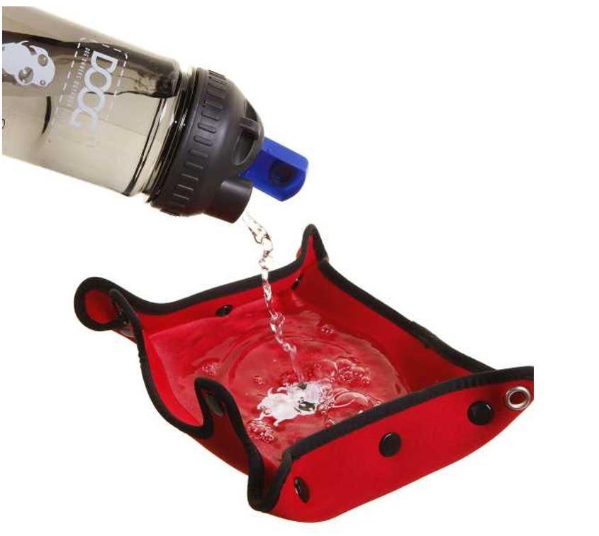 water being poured from the DOOG water bottle into the red neoprene waterproof bowl