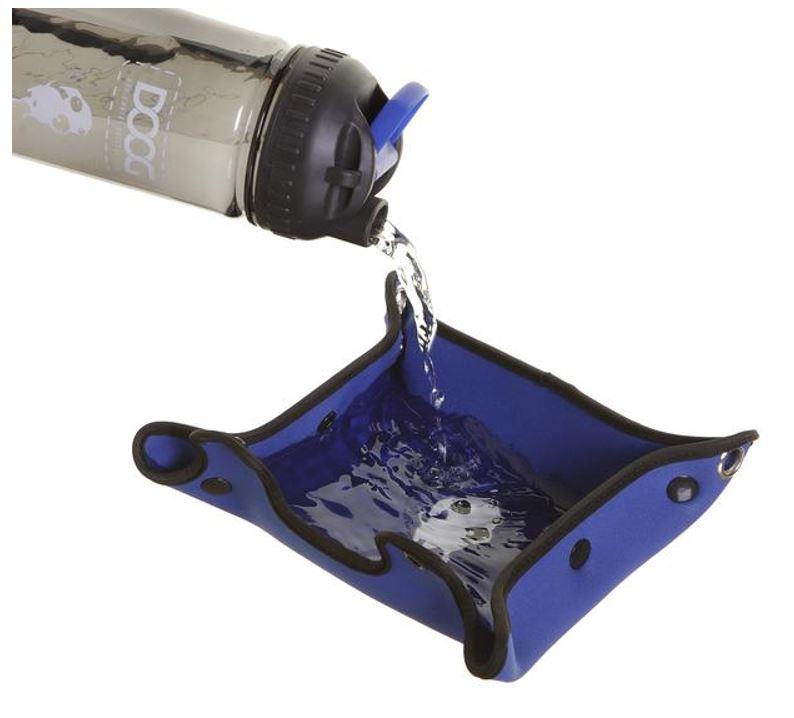 water being poured from the DOOG water bottle into the blue neoprene waterproof bowl