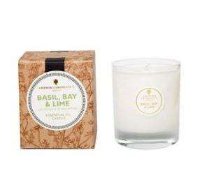 Ivory candle in clear glass pot label shows Amphora Basil & Bay