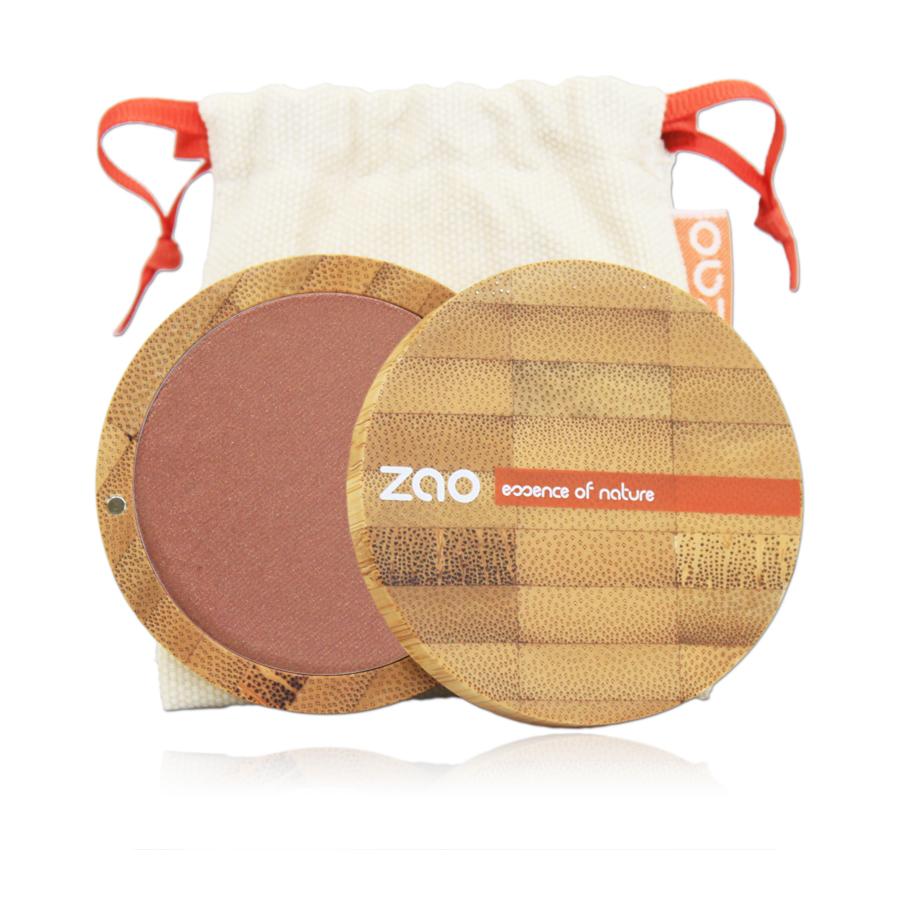 Golden Coral Blusher shown in open bamboo compact case with natural cotton pouch behind, label shows Zao
