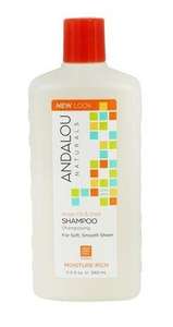A white plastic bottle with orange flip top cap. Label shows andalou argan moisture rich shampoo