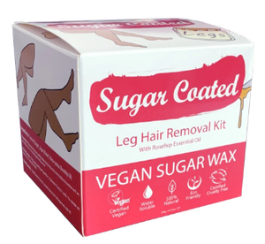 A red and white square box with hand drawn images of legs and waxing jars. Label shows sugar coated leg hair removal kit.