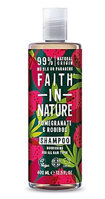 A clear bottle and cap, decorative label shows graphics of red pomegranate fruit and green leaves on black background. Label shows faith in nature pomegranate and rooibos shampoo