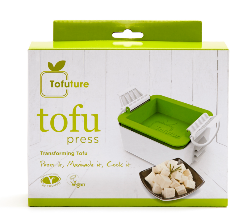 A white and green box with an image of green tofu press on kitchen work surface and chopped tofu.