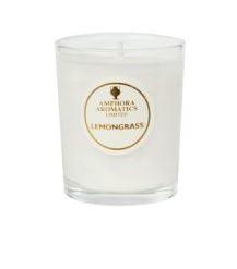 ivory candle in clear glass pot labelled amphora lemongrass