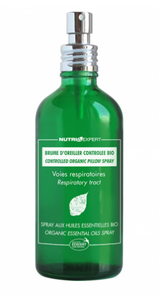green glass bottle with silver atomiser top. White text labelling showing organic respiratory pillow spray.