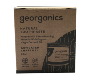 A natural brown card board box packaging with image of jar. Label shows georganics natural toothpaste activated charcoal
