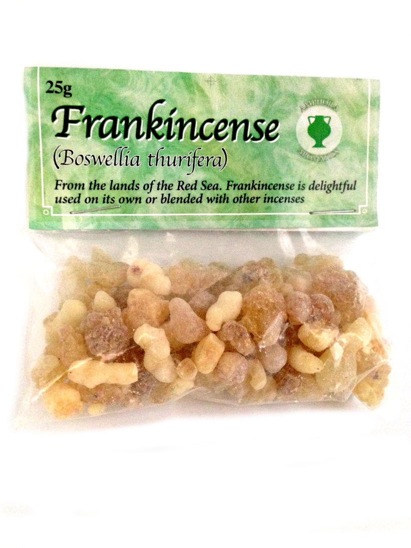 A clear plastic packet containing yellow resin. Green card label attached showing Frankincense .