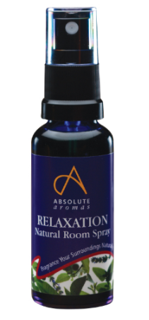 A small dark blue glass bottle with black atomiser top and clear cap. Blue label shows absoloute aromas relaxation room spray.