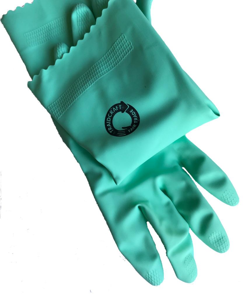 Pair of green rubber gloves showing black fair trade mark stamp