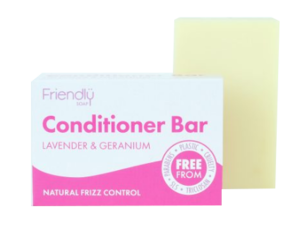 A pink and white rectangle card soap box with Pink Text Labelling, next to a natural cream bar of soap. Labelling shows friendly soap conditioner bar lavender and geranium.