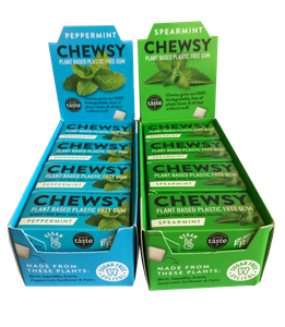 two cardboard display boxes one in bright green labelled chewsy spearmint, one bright blue labelled chewsy peppermint. Display boxes contain box packets of gum in bright green spearmint or bright blue peppermint