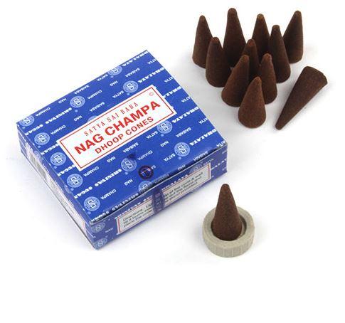 A square blue box with red and white labelling showing satya sai baba nag champa dhoop cones. Brown incense cones shown along with small natural clay stand.
