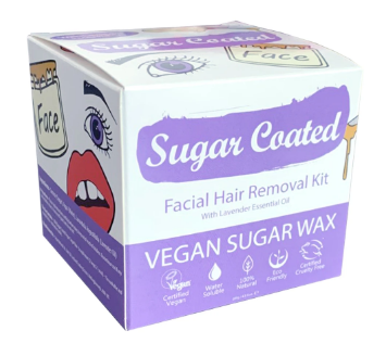 A purple and white card box with hand drawn images of eye brows and waxing jar. Label shows sugar coated facial hair removal kit.