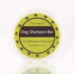 white paper wrapped soap bar, green label with brown paw prints, brown label white text Trevarno Dog Shampoo Bar
