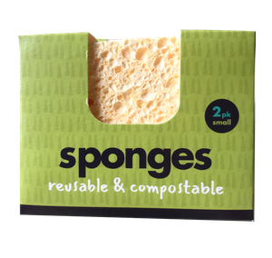 Bright green card packaging box with open front showing natural yellow sponges. Labelling shows Sponges in Black text and reusable and compostable in white text
