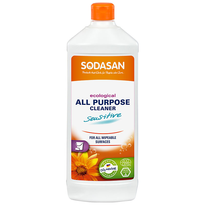 A white plastic bottle with orange cap orange label shows sodasan all purpose cleaner