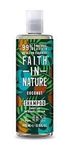 A clear plastic bottle with white cap. Black label decorated with brown coconuts, blue and green leaves. Label shows faith in nature coconut shampoo in white.