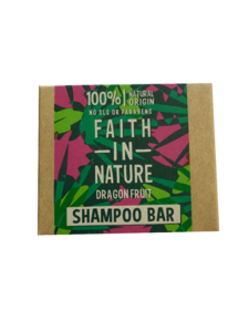 A rectangle natural brown card soap box with pink and green tropical leaf and fruit pattern. Labelling shows faith in nature dragon fruit shampoo bar.