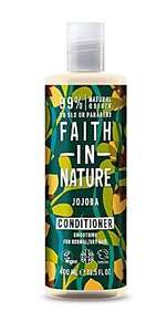 A clear plastic bottle and cap. Decorative green label showing images of jojoba nuts and leaves. label shows faith in nature jojoba conditioner.