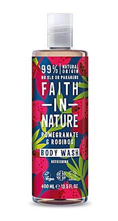 A clear plastic bottle and cap with graphic image label of red flowers and green leaves on a dark blue background. Label shows faith in nature pomegranate and rooibos shampoo.