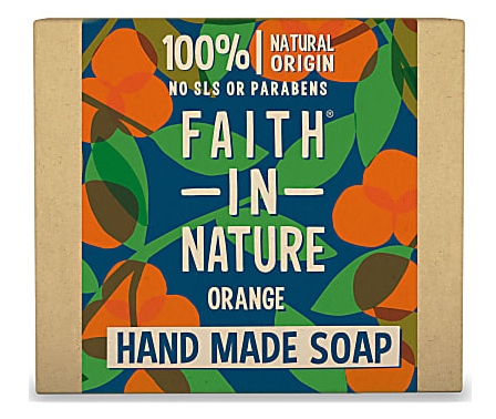 A natural brown card box with illustrated label of green leaves and orange flower blossom. Label shows faith in nature orange soap.