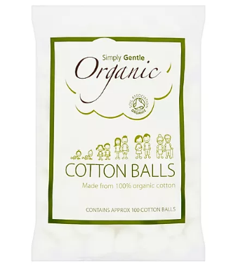 a clear plastic bag of white cotton wool balls. Green text labelling shows simply gentle organic cotton balls.