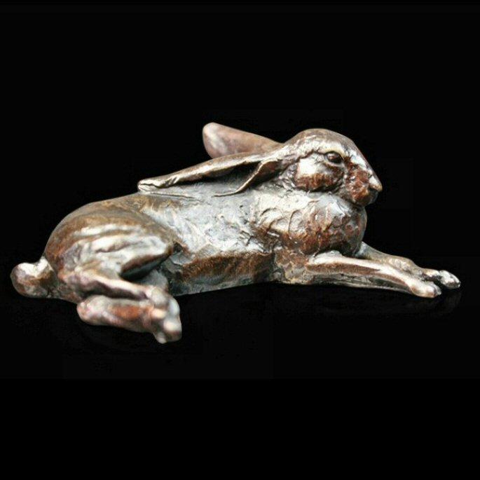 Small Hare Lying (985) in bronze by Michael Simpson