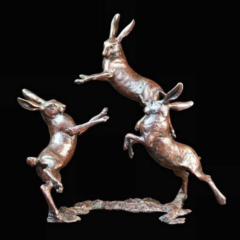 Medium Hares Playing (800) in bronze by Michael Simpson