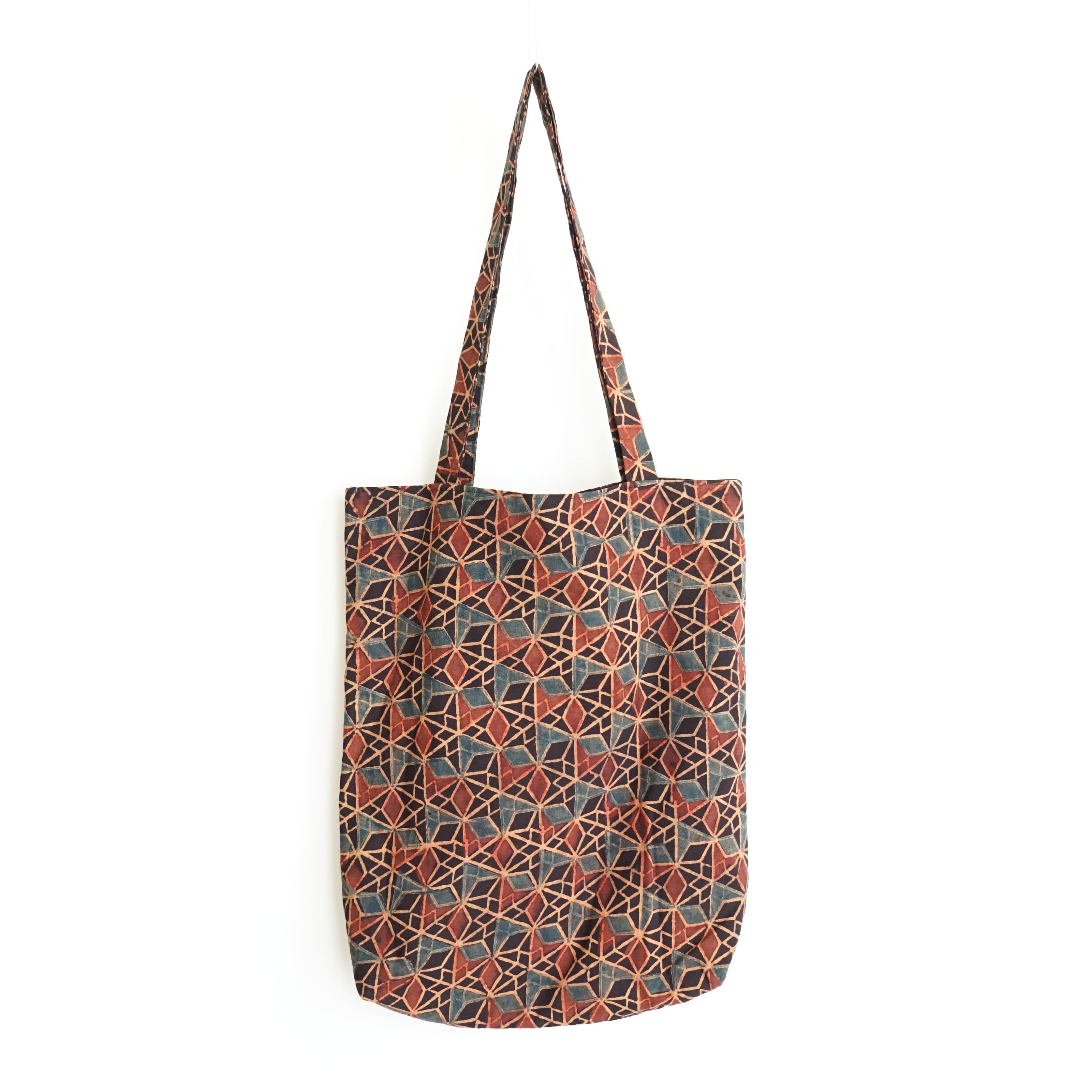 block printed cotton tote bag, black, red ochre blue wing design, natural dye, lined with black cotton, closed