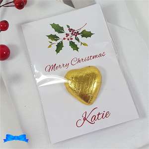 Christmas table favour with holly and gold chocolate heart