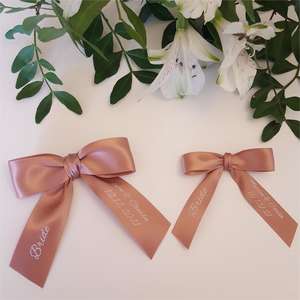 Rose gold bows with guest names