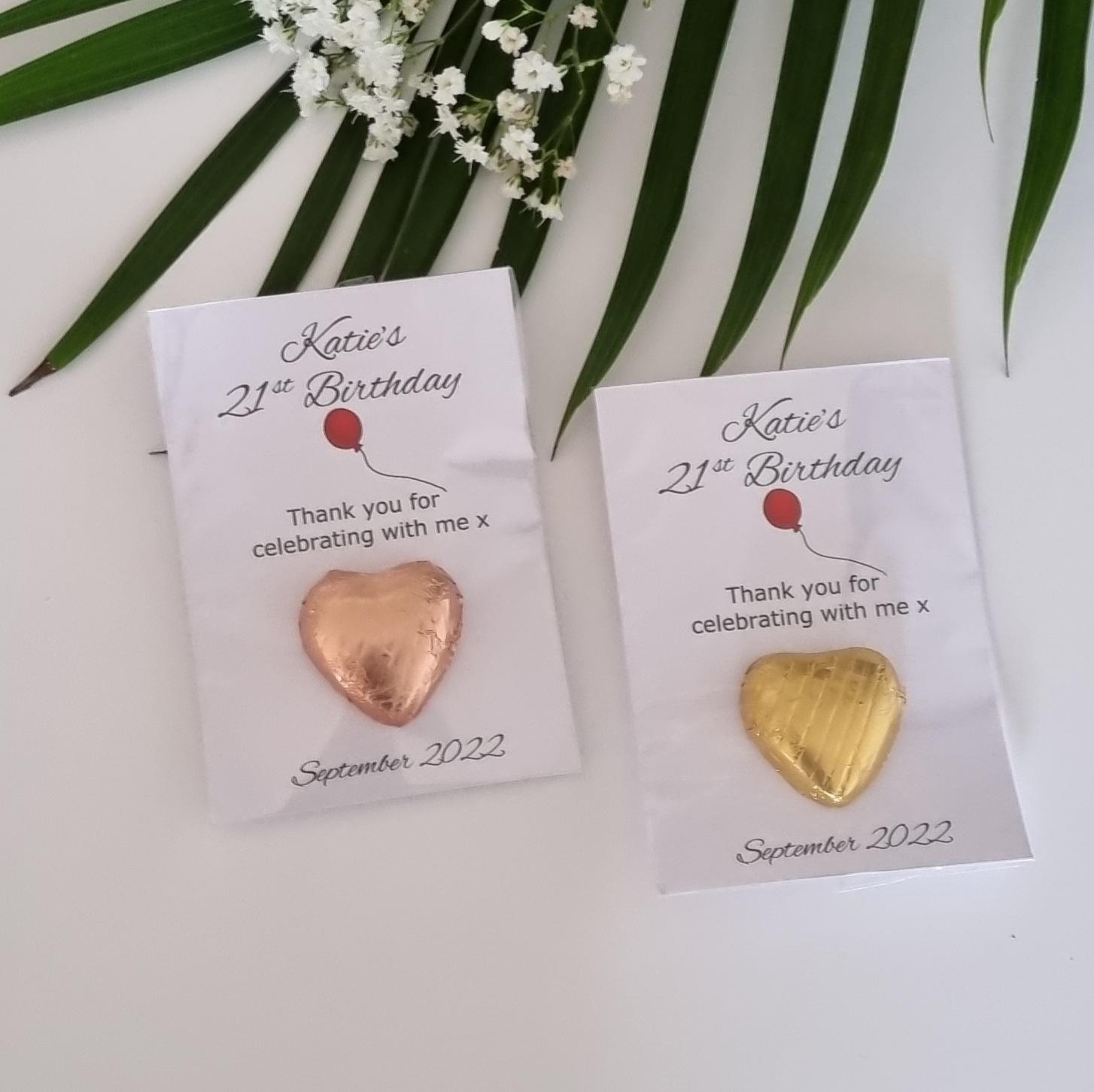 Red Balloon on a string and gold Chocolate heart party favours