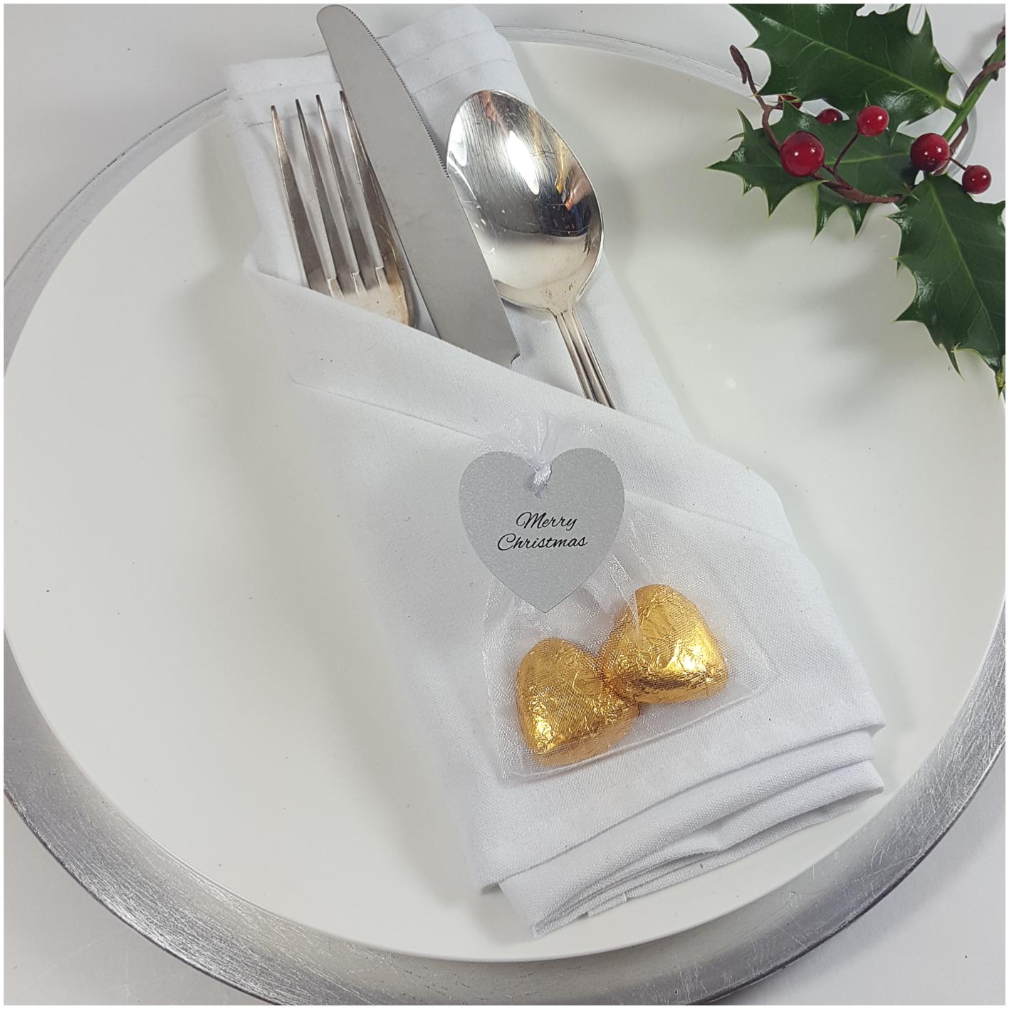 Silver shaped heart chocolates in organza bag