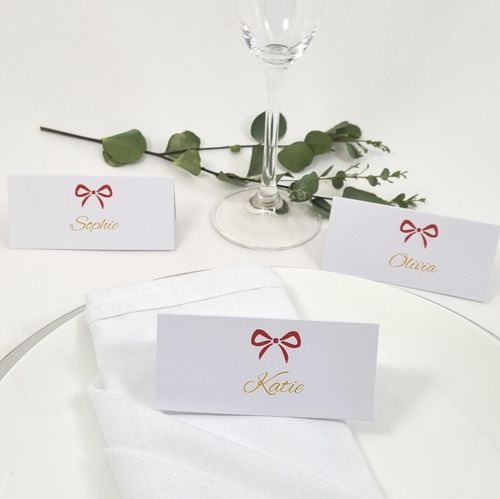 Christmas place card with red bow and leaves