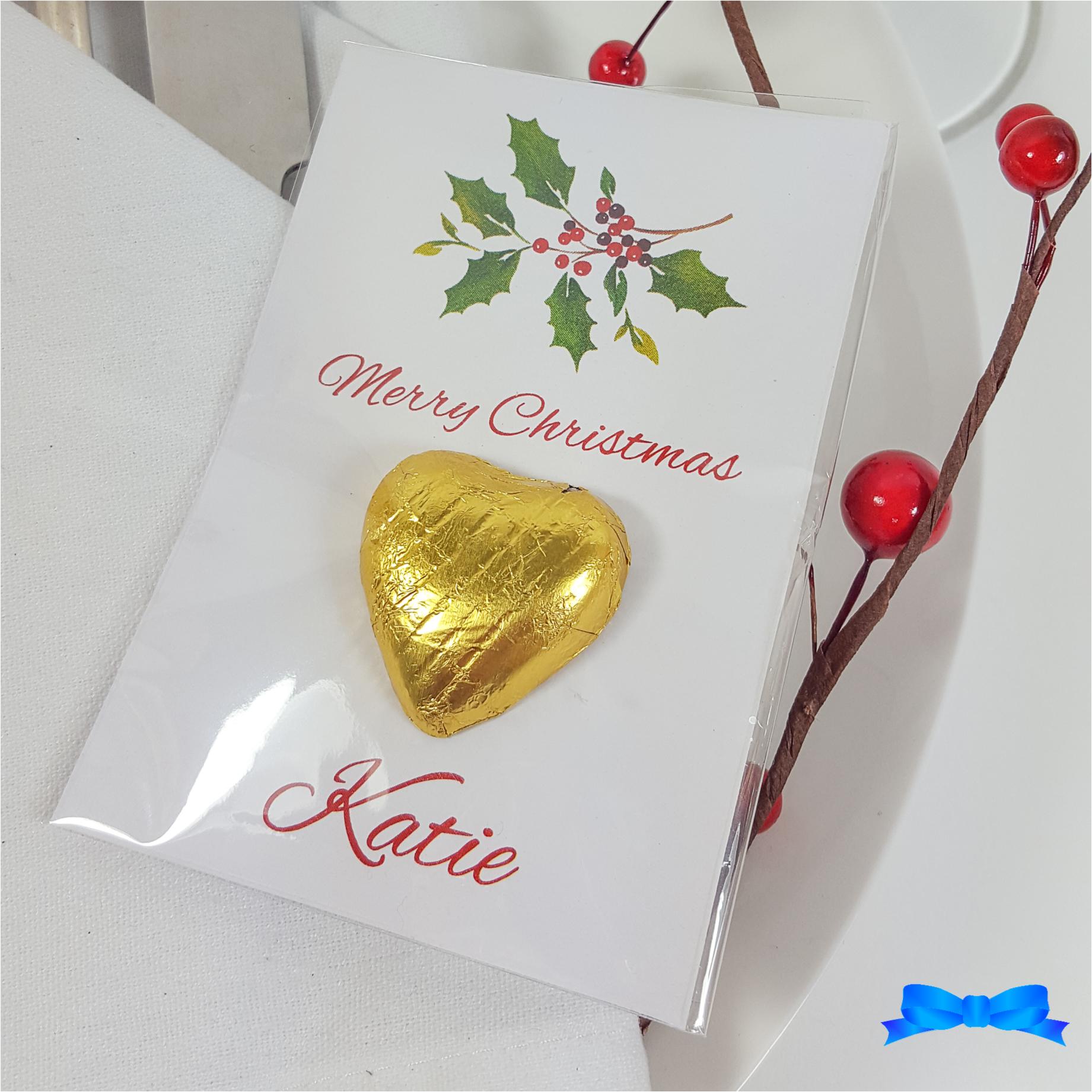 Christmas table favour with holly and gold chocolate hearts