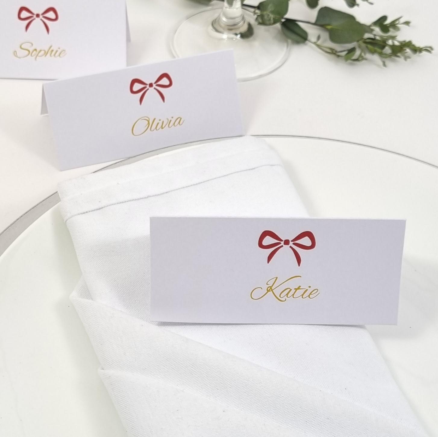 personalised-christmas-place-cards-red-bow-place-setting-name-card