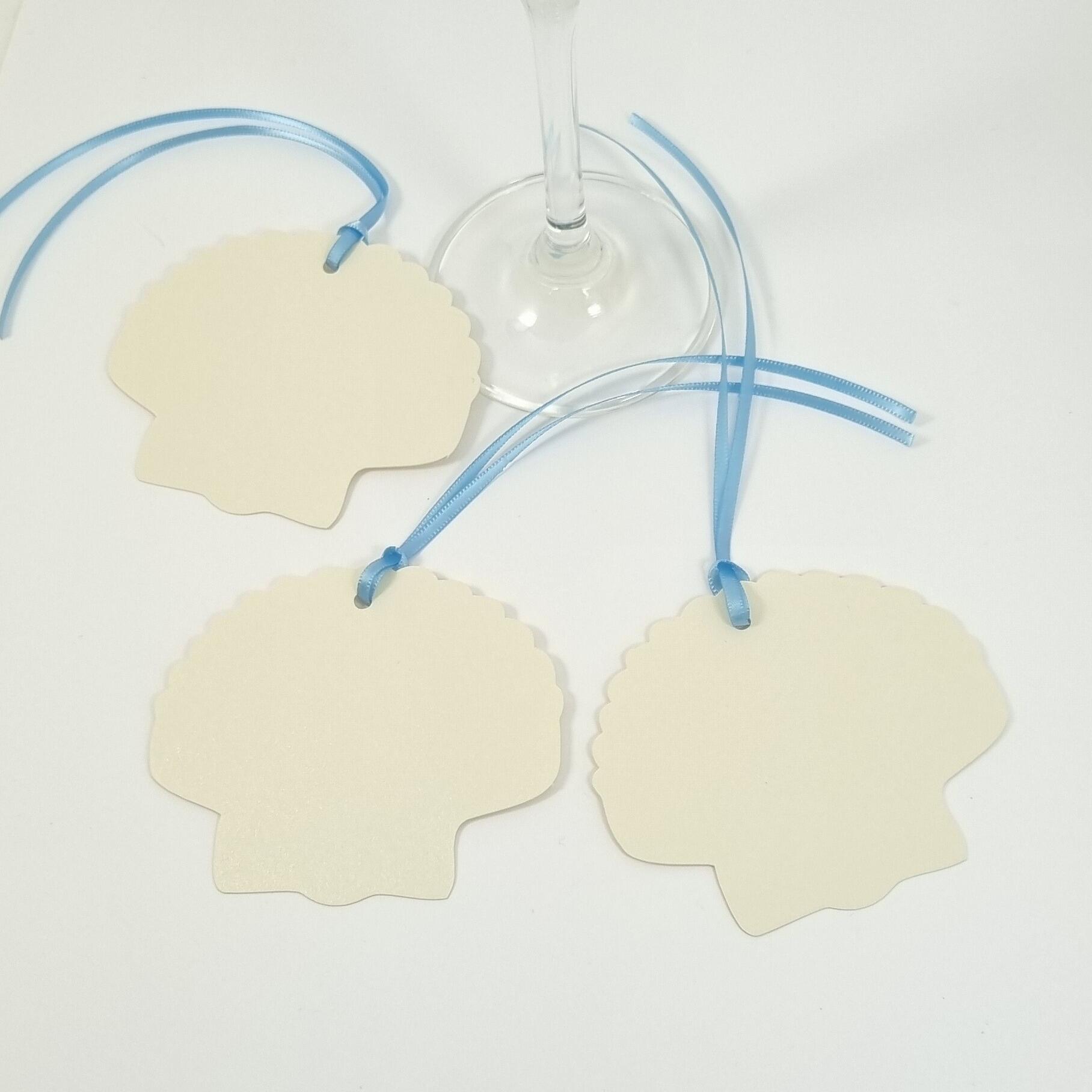 Shell shaped tags with light blue ribbon
