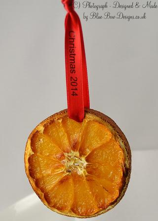 Red personalised ribbon on Christmas dried orange slice